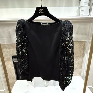 Black top with lace details on sleeves